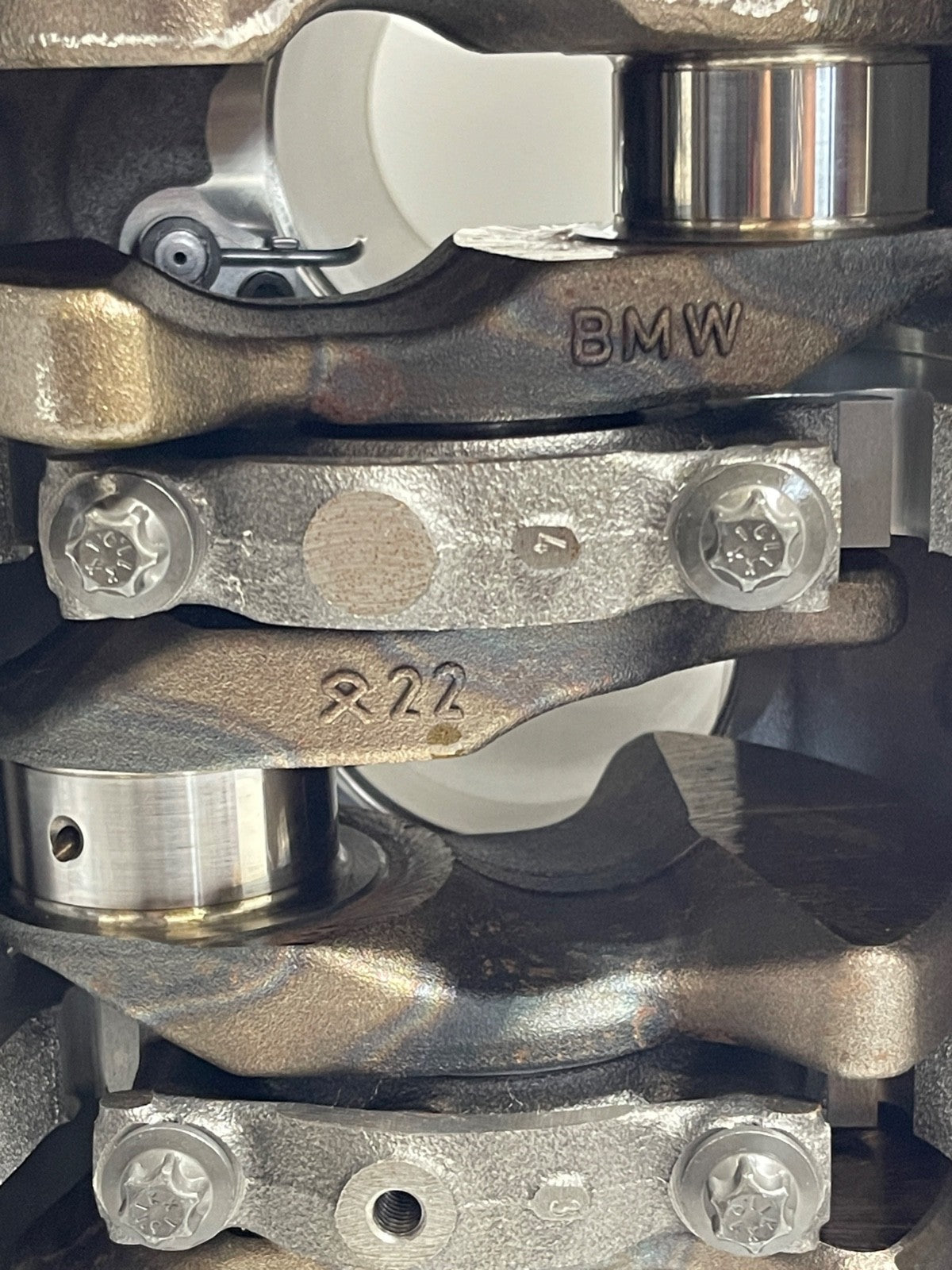 7676698