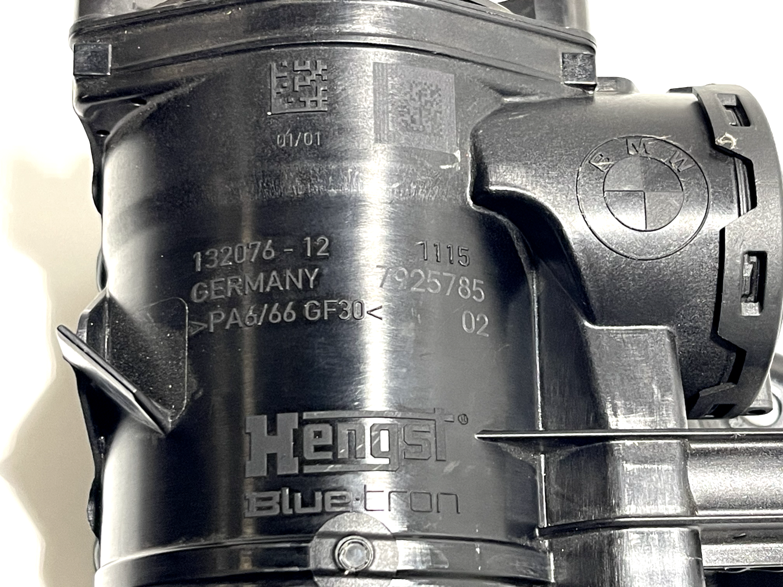 6916077